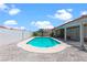 Private in-ground pool surrounded by pavers, offering an inviting space for relaxation and recreation with a covered patio at 608 Blooming View Ave, North Las Vegas, NV 89032