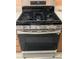 Stainless steel gas range and oven with five burners and digital display at 608 Blooming View Ave, North Las Vegas, NV 89032