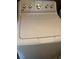 White top load washing machine with multiple settings and temperature controls at 608 Blooming View Ave, North Las Vegas, NV 89032