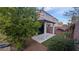 The backyard has a covered patio, some decorative rock, and some well placed plants at 6339 Sharp Rock Ct, Las Vegas, NV 89139