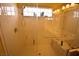 Detail of large walk-in shower with a small window and built-in seat at 6339 Sharp Rock Ct, Las Vegas, NV 89139