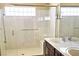 Well-lit bathroom offering double sinks, white countertops and a glass enclosed shower at 6339 Sharp Rock Ct, Las Vegas, NV 89139