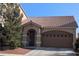 Charming single-story home with a desert landscaped front yard and a brown-toned garage door at 6339 Sharp Rock Ct, Las Vegas, NV 89139