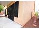 Side exterior featuring iron security bars and a gravel walkway that extends to the backyard at 6339 Sharp Rock Ct, Las Vegas, NV 89139