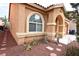Charming home with desert landscaping, stone accents, and an arched entry at 6339 Sharp Rock Ct, Las Vegas, NV 89139