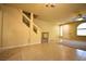 Comfortable living area with tiled flooring, staircase and natural light at 6339 Sharp Rock Ct, Las Vegas, NV 89139