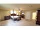 Beautifully staged bedroom with a four poster bed, neutral walls and large footprint at 6339 Sharp Rock Ct, Las Vegas, NV 89139