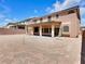 Large backyard with a covered patio, perfect for entertaining or relaxation at 6465 Grande River Ct, Las Vegas, NV 89139
