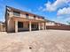 Wide view of a large backyard with a covered patio, ideal for outdoor activities at 6465 Grande River Ct, Las Vegas, NV 89139