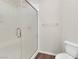 Modern bathroom featuring a glass-enclosed shower and efficient toilet at 6465 Grande River Ct, Las Vegas, NV 89139