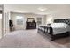 A neutral primary bedroom offers ample space, large windows, and plush carpet for maximum comfort at 6465 Grande River Ct, Las Vegas, NV 89139