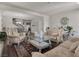 Comfortable living room featuring an open floor plan with lots of comfortable seating and natural light at 6465 Grande River Ct, Las Vegas, NV 89139