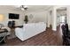 A well-lit living room with hardwood flooring, a large sofa, and modern decor at 6465 Grande River Ct, Las Vegas, NV 89139