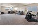 The second floor loft is complete with plush carpet, recessed lighting, and large windows for lots of light at 6465 Grande River Ct, Las Vegas, NV 89139