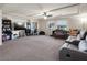 This large loft offers recessed lights, ceiling fan, neutral walls, large windows and plush carpet at 6465 Grande River Ct, Las Vegas, NV 89139