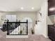 Cozy loft area with a view of the lower level and a drum kit in the corner at 6465 Grande River Ct, Las Vegas, NV 89139