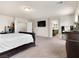 Primary bedroom showing ample space with plush carpet, and access to the on-suite bathroom at 6465 Grande River Ct, Las Vegas, NV 89139