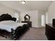 Elegant main bedroom with luxurious furniture and plush carpeting at 6465 Grande River Ct, Las Vegas, NV 89139