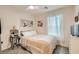 Comfortable bedroom with neutral tones, a plush bed, and plenty of natural light at 6835 Orange Horizon St, North Las Vegas, NV 89086