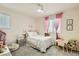 Bright and airy bedroom with a comfortable bed, soft lighting, and a playful decor at 6835 Orange Horizon St, North Las Vegas, NV 89086