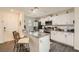 Modern kitchen features white cabinets, granite countertops, and stainless steel appliances at 6835 Orange Horizon St, North Las Vegas, NV 89086