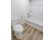 Clean, white bathroom with a shower and toilet at 6842 Greengrove Dr, Las Vegas, NV 89103
