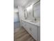 Bathroom with marble countertops, dual sinks, and brushed gold fixtures at 6842 Greengrove Dr, Las Vegas, NV 89103