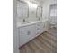 Bathroom with marble countertops, dual sinks, and brushed gold fixtures at 6842 Greengrove Dr, Las Vegas, NV 89103
