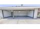 Spacious garage with an open door; the interior and floor are painted gray at 6842 Greengrove Dr, Las Vegas, NV 89103