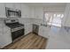 Modern kitchen features stainless steel appliances, sleek countertops, and ample cabinet space at 6842 Greengrove Dr, Las Vegas, NV 89103