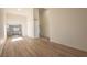 Spacious living room featuring wood flooring and high ceilings. View to kitchen at 6842 Greengrove Dr, Las Vegas, NV 89103