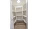 Walk-in pantry with white shelving and laminate floors at 6842 Greengrove Dr, Las Vegas, NV 89103