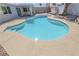 Sparkling pool in backyard features seamless decking, enhancing outdoor enjoyment at 6842 Greengrove Dr, Las Vegas, NV 89103