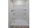 Shower stall with built-in shelves and gold fixtures at 6842 Greengrove Dr, Las Vegas, NV 89103