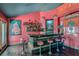 Elegant bar area with a granite countertop, red walls, and a range of spirits at 7296 Mission Hills Dr, Las Vegas, NV 89113