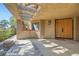 Inviting entryway with double doors and a concrete patio at 7296 Mission Hills Dr, Las Vegas, NV 89113