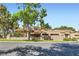 Exterior shot of the home featuring a landscaped front yard and well-maintained facade at 7296 Mission Hills Dr, Las Vegas, NV 89113