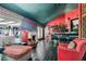 Luxurious living room featuring a fireplace, bar area, and stylish decor at 7296 Mission Hills Dr, Las Vegas, NV 89113