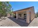 Home's rear exterior features a large covered patio and low-maintenance yard at 7448 Lintwhite St, North Las Vegas, NV 89084