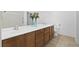 Bathroom with double sink vanity, plenty of cabinet space, and tile flooring at 7448 Lintwhite St, North Las Vegas, NV 89084