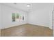 Neutral bedroom with tile floors and bright, natural light at 7448 Lintwhite St, North Las Vegas, NV 89084