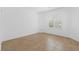 Neutral bedroom with tile floors and bright, natural light at 7448 Lintwhite St, North Las Vegas, NV 89084