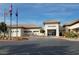 Exterior view of Sun City Aliante community center with flags and parking at 7448 Lintwhite St, North Las Vegas, NV 89084
