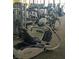 Assortment of fitness machines in a community workout room with carpeting at 7448 Lintwhite St, North Las Vegas, NV 89084