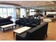Enjoy the game room with comfortable seating, pool tables and ample natural light at 7448 Lintwhite St, North Las Vegas, NV 89084
