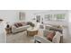 Bright living room with modern furniture, neutral tones and lots of natural light at 7448 Lintwhite St, North Las Vegas, NV 89084