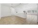 Expansive living space featuring neutral tile flooring, crisp white walls, and an open floor plan at 7448 Lintwhite St, North Las Vegas, NV 89084