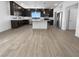 Modern kitchen with dark cabinets, a center island, and stainless steel appliances at 7791 Misty Oaks Ave, Las Vegas, NV 89113