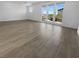 Bright living room featuring tile floors, large windows that provide lots of natural light and great outdoor views at 7791 Misty Oaks Ave, Las Vegas, NV 89113