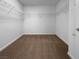 Walk-in closet with neutral carpet and wire shelving for organized storage at 7791 Misty Oaks Ave, Las Vegas, NV 89113